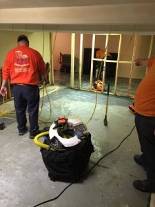 Water Damage Palm Coast Technicians Cleaning Carpet After A Flood